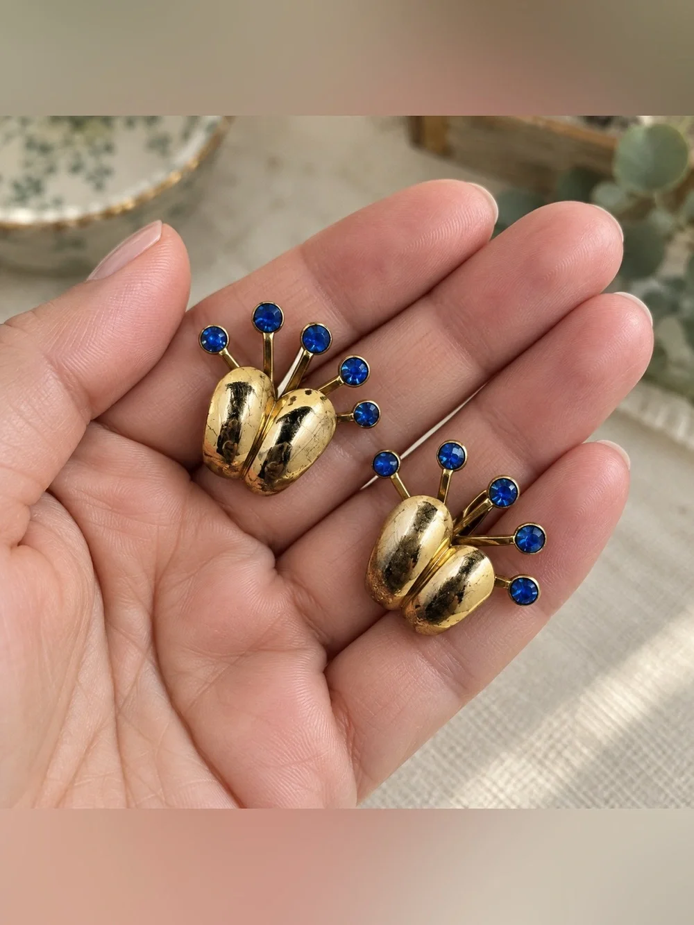 Gold-tone Clip Earrings with Blue Crystal Accents